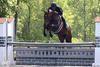 with Bruce in tack on their way to be announced and awarded with the Champion ribbon. 